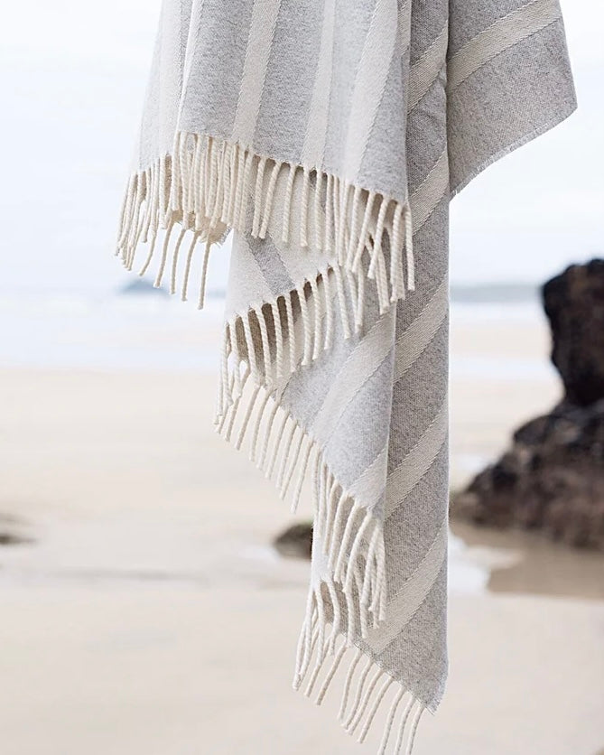 Cozy throws and blankets by Atlantic Blankets, made from recycled wool. Perfect for home decor, picnics, and beach outings. Beautifully woven and eco-friendly.
