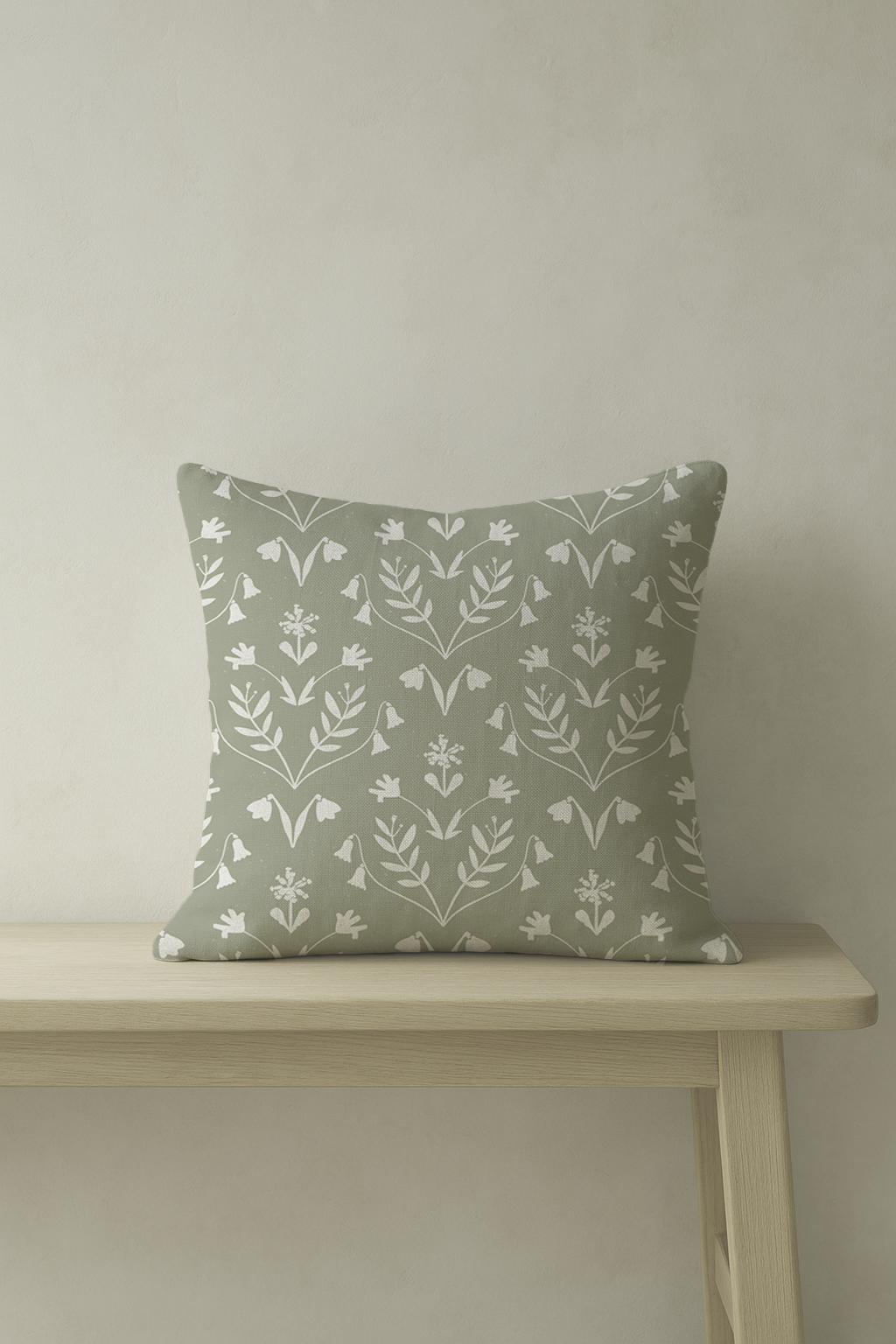 A vintage green floral cushion with blush stripe reverse. Crafted in the UK from natural cotton-linen. Made for calm, layered homes.