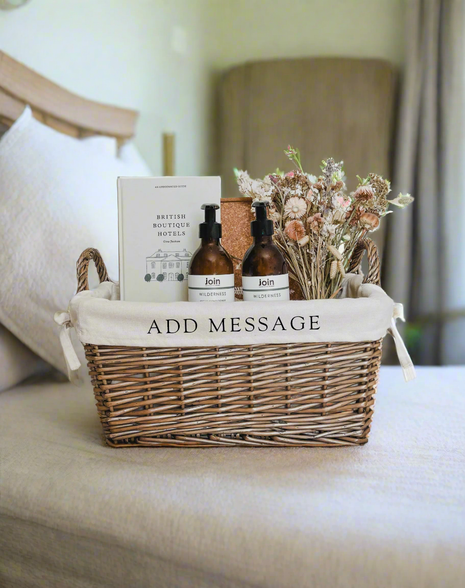 Luxury hotel welcome baskets, personalised wicker hampers for boutique stays and UK hospitality.