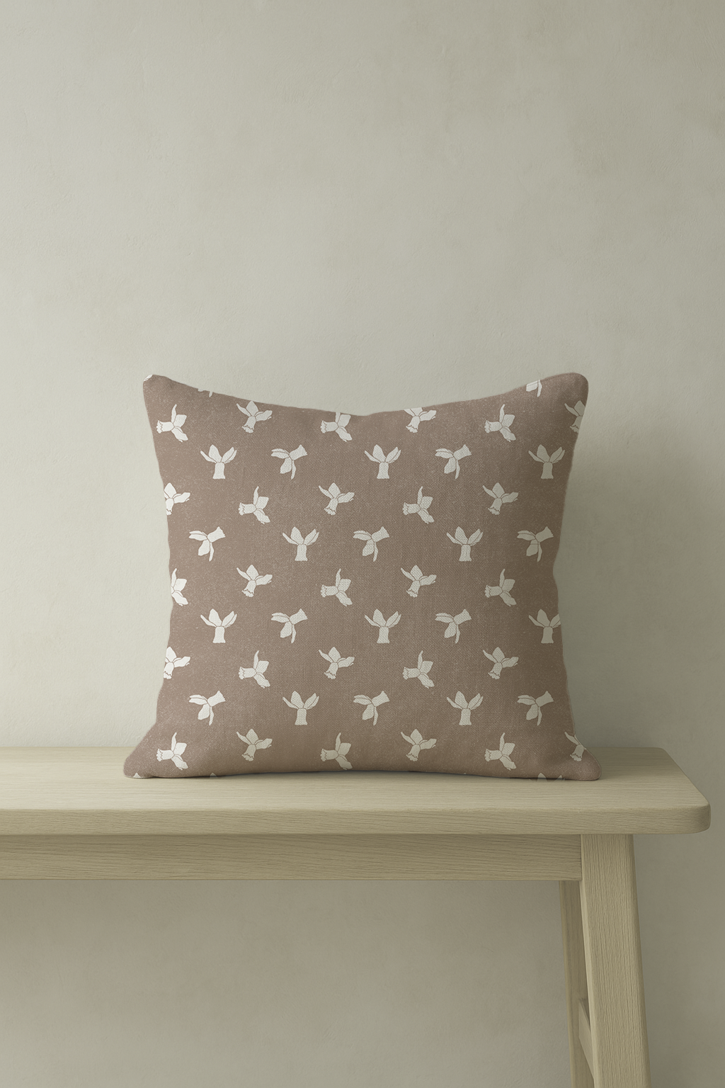 A warm clay cushion with daffodil motif. Handmade in the UK using soft cotton-linen — perfect for peaceful interiors.