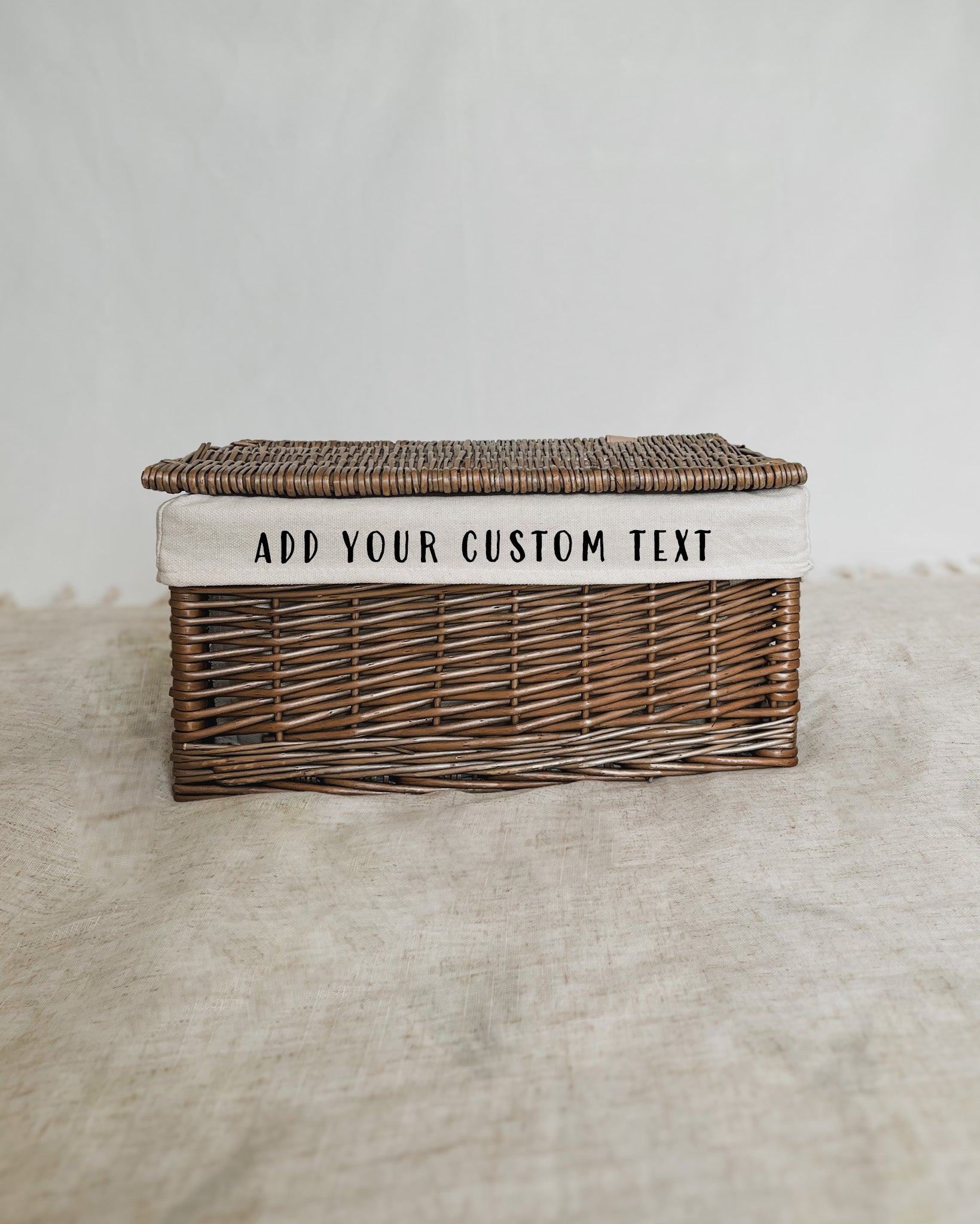 Medium rectangular wicker picnic hamper with personalized cotton lining, ideal for alfresco dining and gifting
